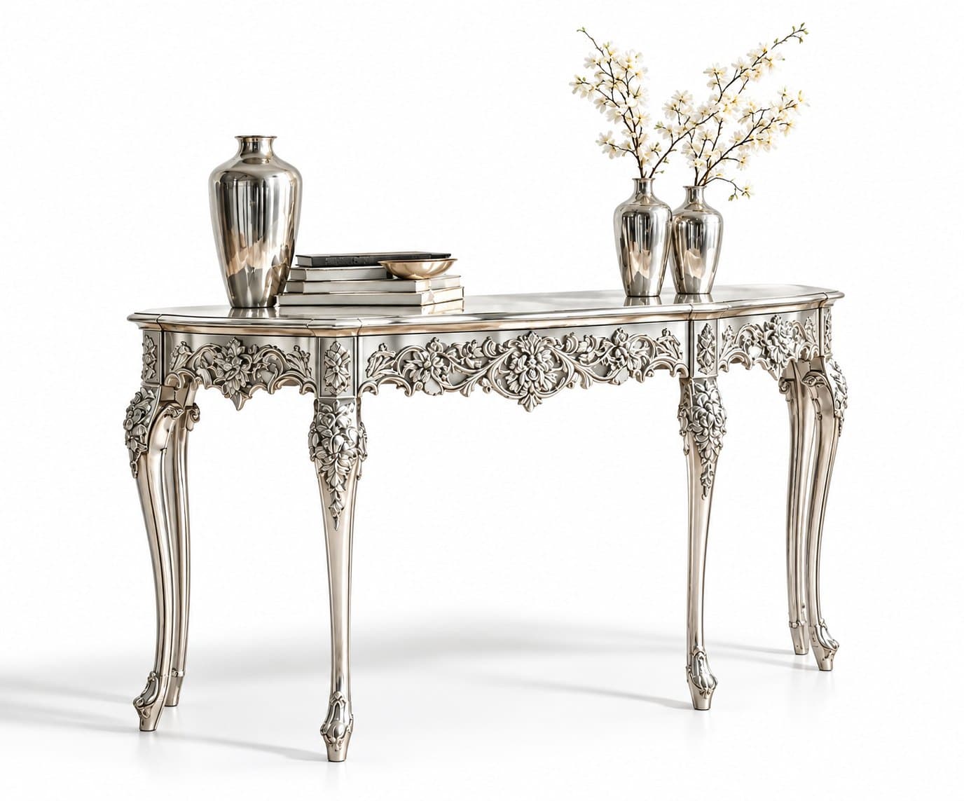 A hand-carved console table in a champagne-silver finish, with a carved floral apron and cabriole legs, seen from three-quarters