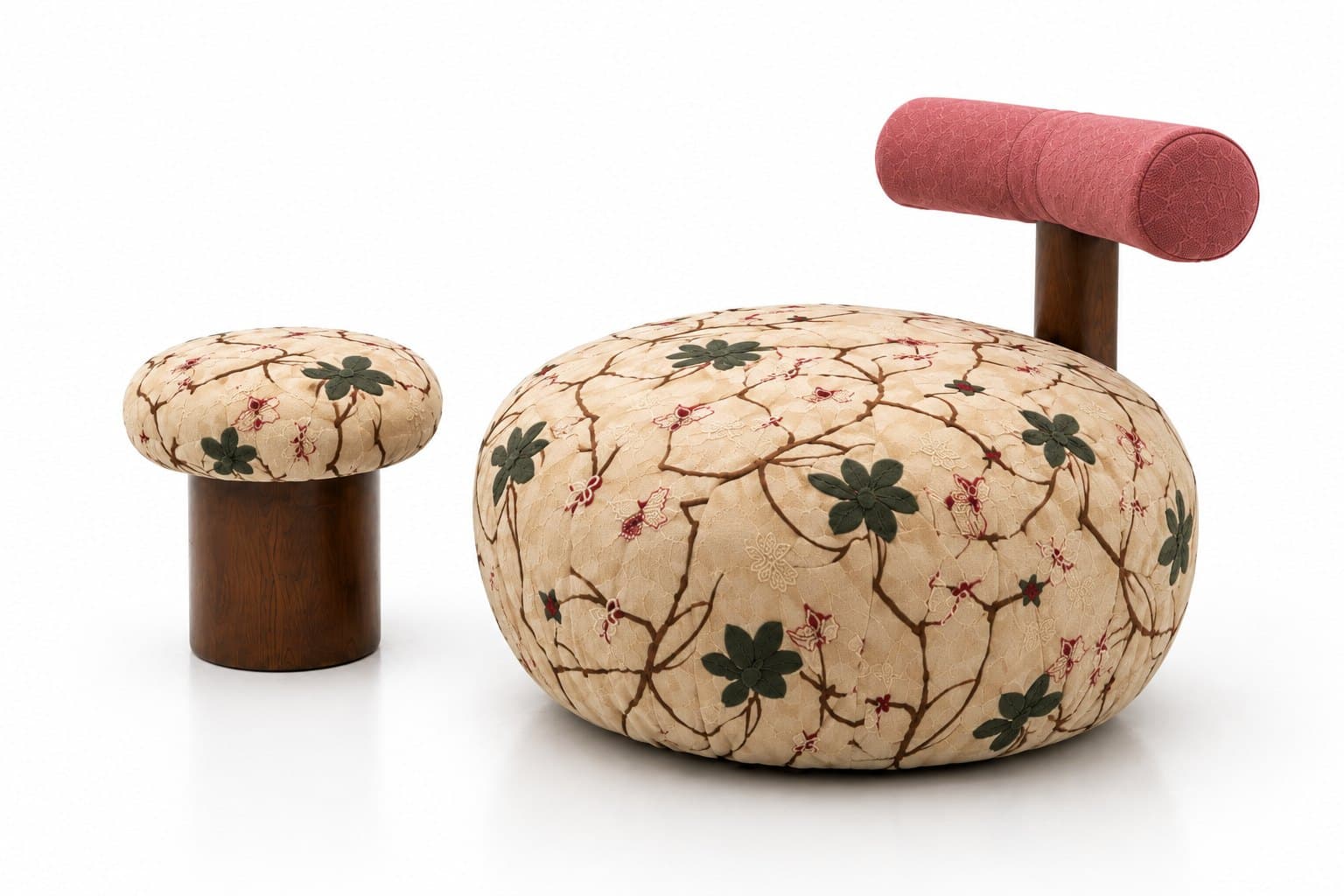 The embroidered chair from the other side, with the stool in front