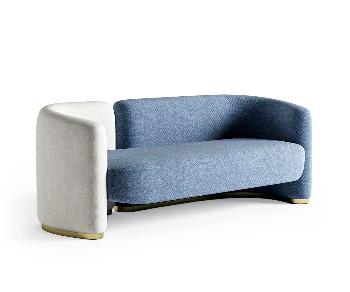 The two-tone sofa seen from three-quarters, showing how the back curves round into the arm