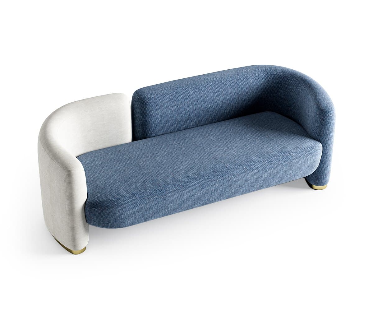 The two-tone sofa from the other side, on its small brass feet