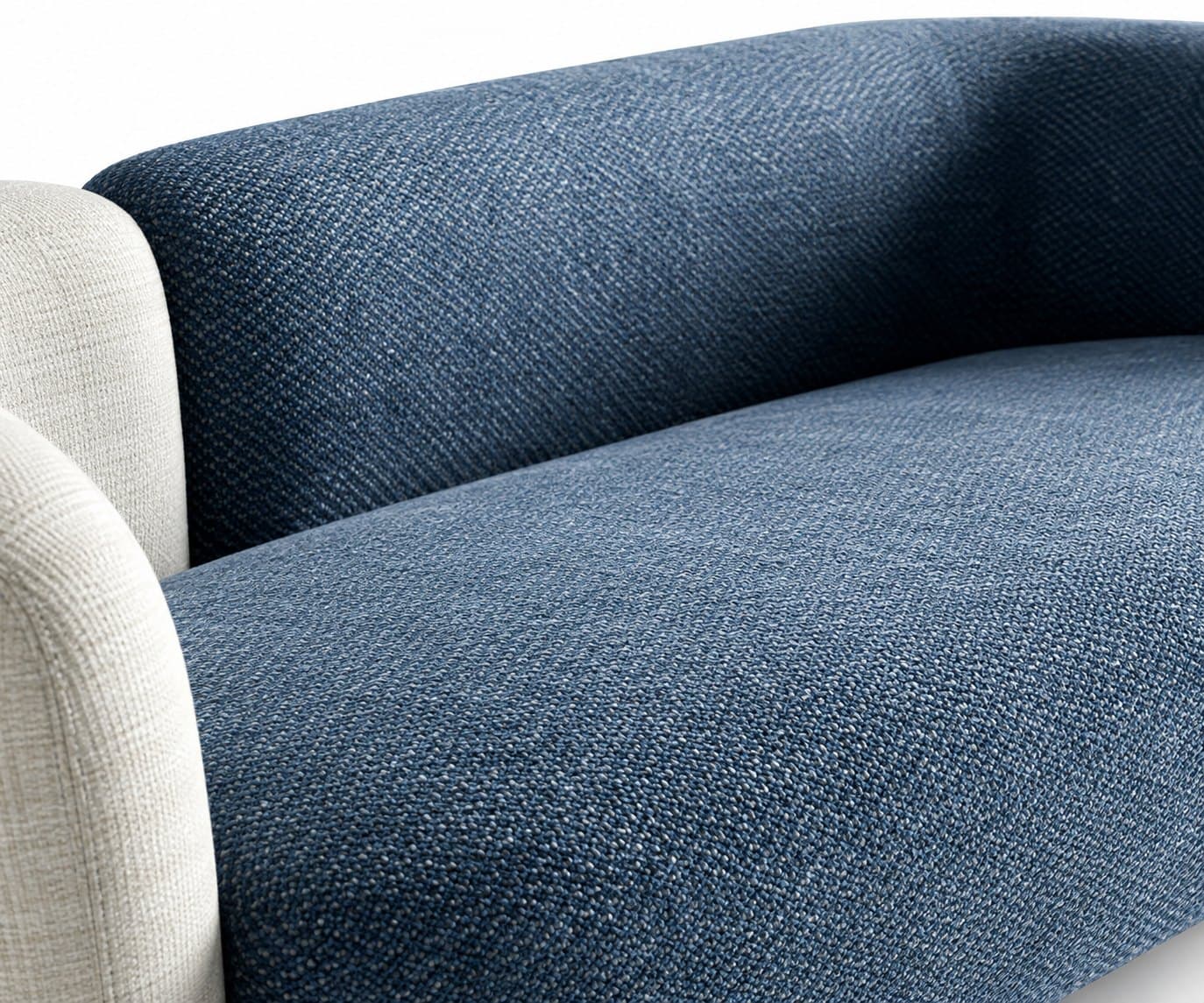 Close-up of the sofa where the cream fabric meets the blue, edge to edge