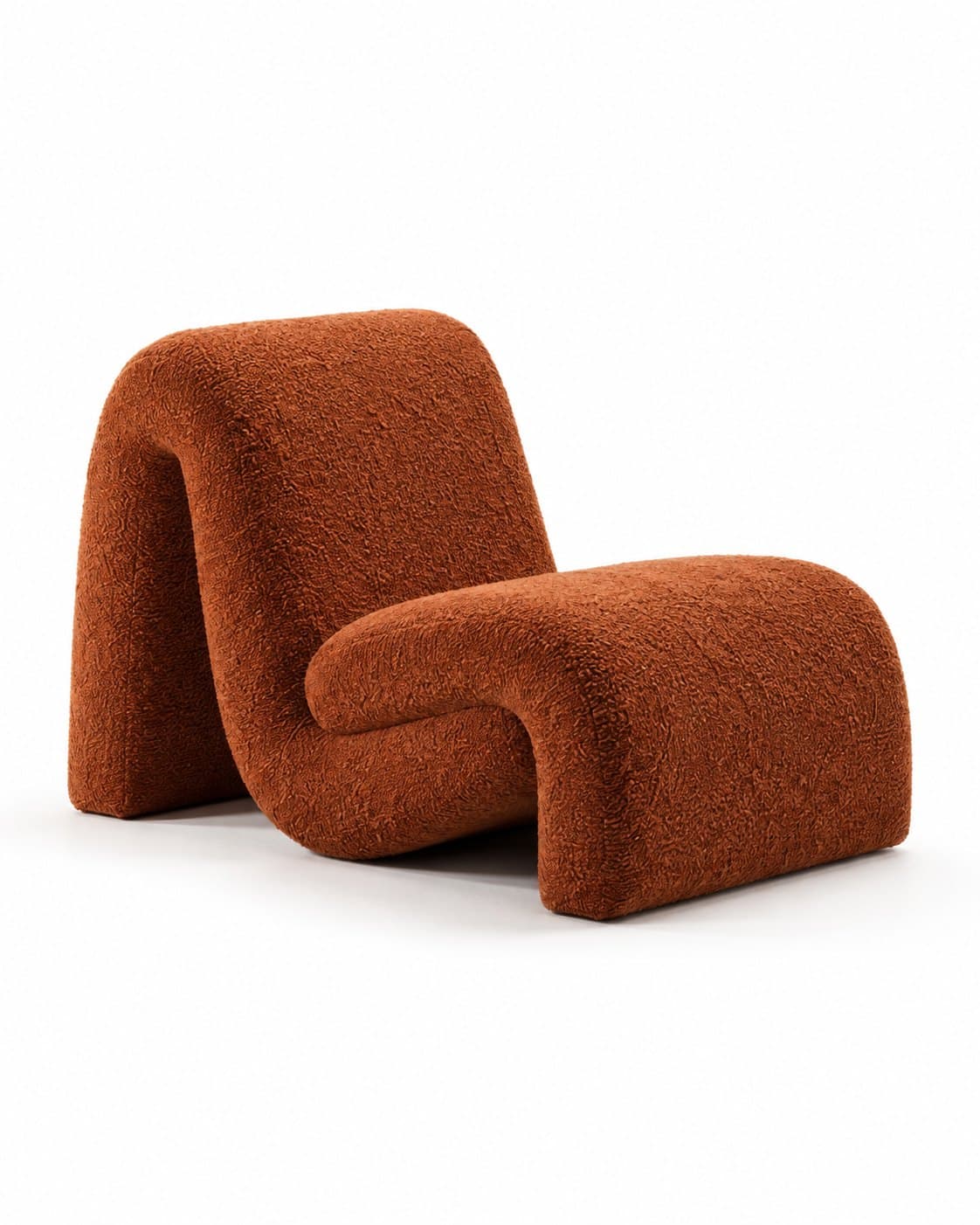 A sculptural lounge chair in rust bouclé, one continuous folded band forming the back and seat, seen from three-quarters